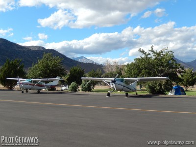 Airplanes parked on the ramp next to the airport campground.
